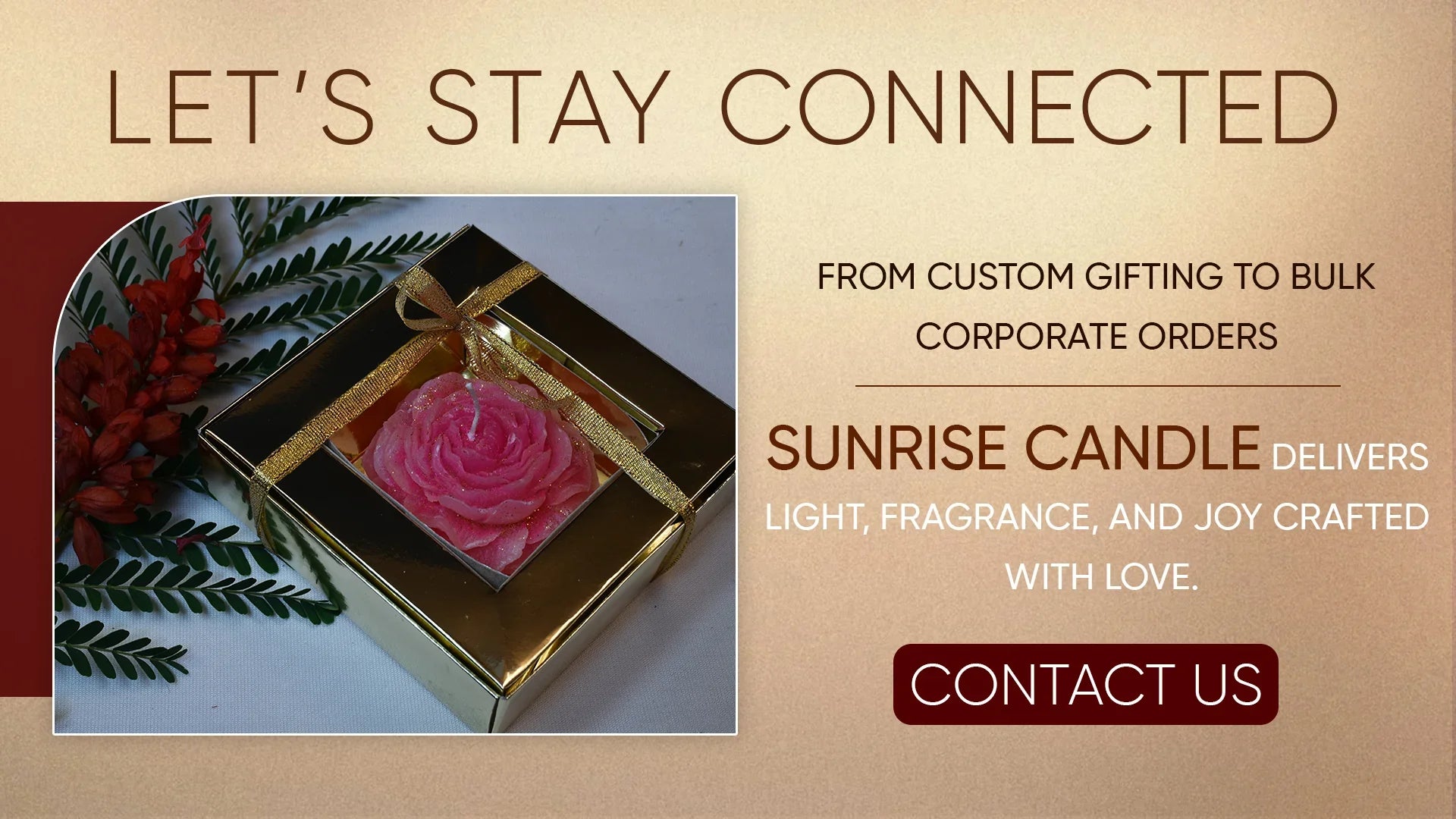 Gift box with pink rose-shaped candle and decorative greenery for custom gifting and corporate orders